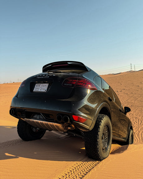 Lifted Porsche Cayenne 958 GTS with Akioverland aki 04 Custom Forged Mesh Wheels Driving in the Desert